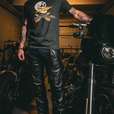 Construction detail of Maverick unisex spandex leather chaps, highlighting stitching and material grain