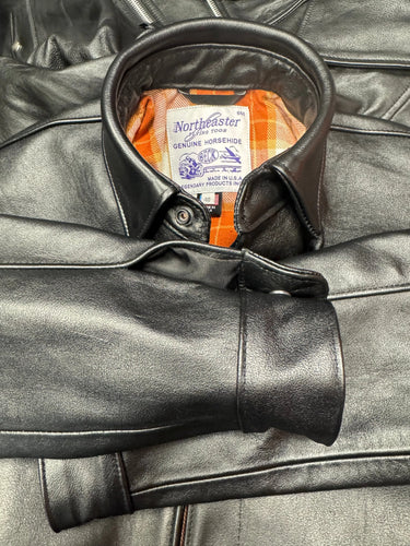 Close-up of BECK® 302 riding shirt collar showing Northeaster Flying Togs label and genuine horsehide craftsmanship.