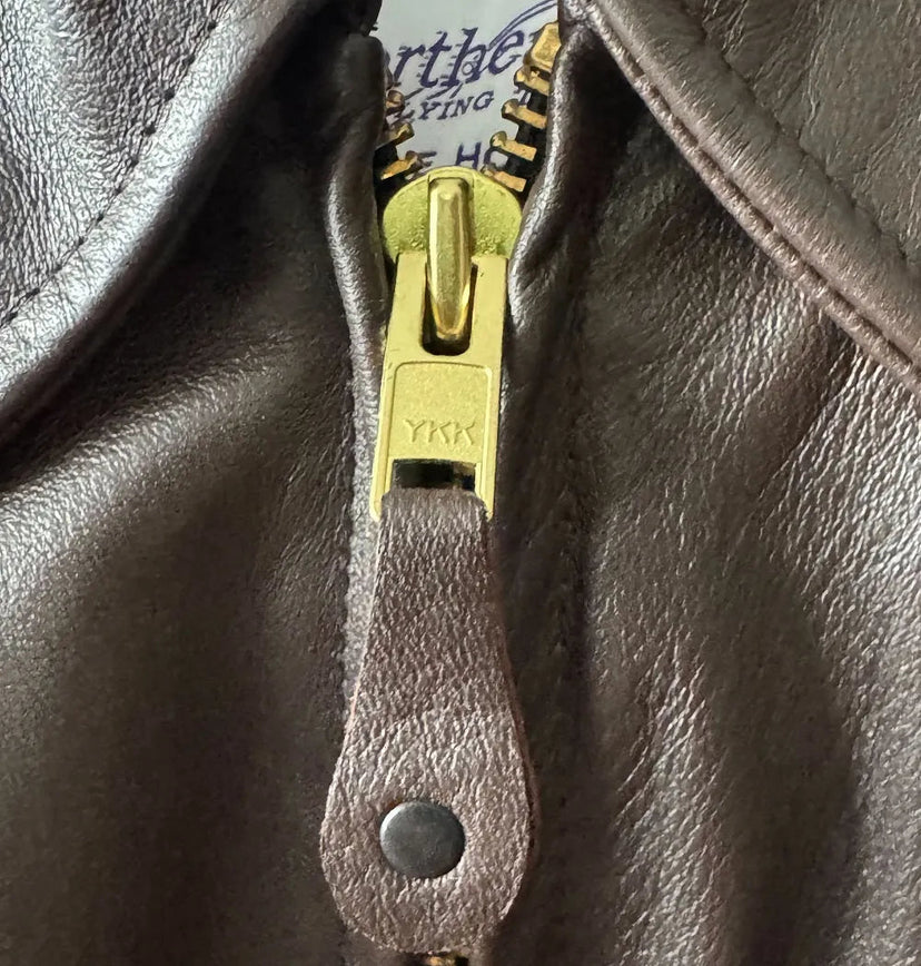 Close-up of YKK main zipper on BECK® 777 Brown Horsehide Jacket with leather pull tab
