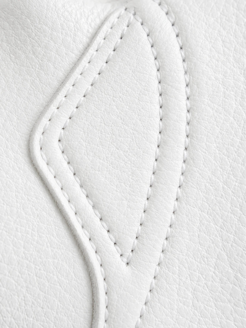 Close-up of the stitching and construction on the Cadbury White Touchscreen Gloves made in USA