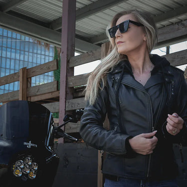 Side profile of Unik leather motorcycle jacket, with hardware and stitching visible