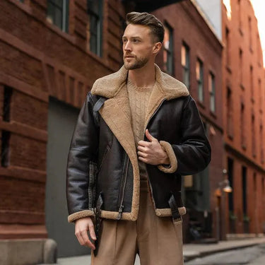 Man wearing the RAF Sheepskin Bomber Jacket partially unzipped on a city street.