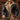 Model in motion wearing the jacket unzipped, showing off its rich leather and warm shearling lining.