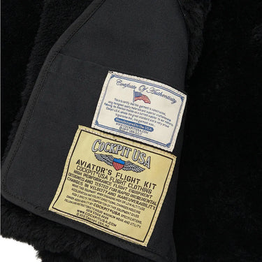 Close-up of Cockpit USA authenticity and aviator's flight kit labels inside the black R.A.F. Bomber Jacket