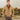 Model wearing Cockpit USA Men's British Khaki WWII Tanker Jacket in military setting