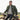 Male model wearing the Cockpit USA WEP Jacket while seated on a vintage motorized bicycle outdoors