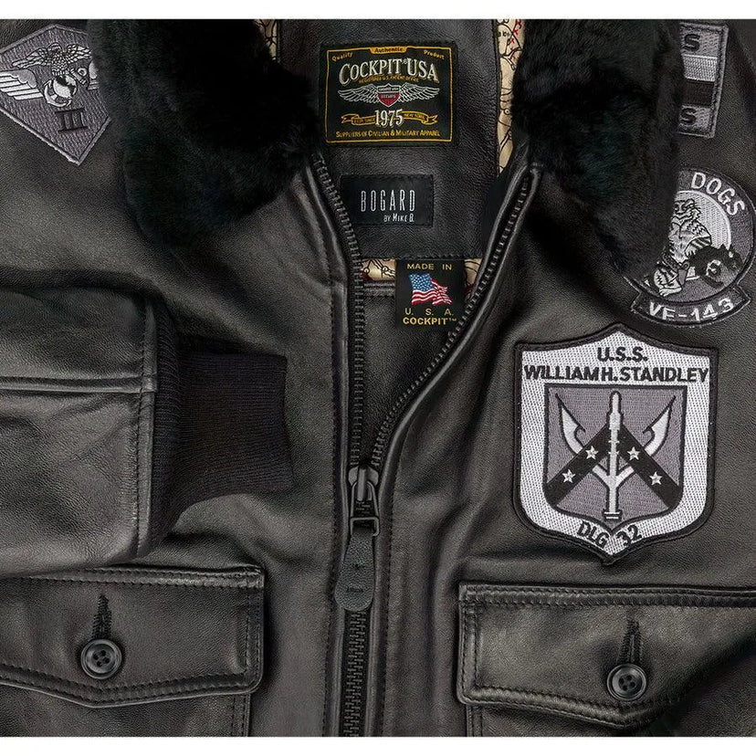 Close-up of front chest area showing embroidered patches and Cockpit USA branding near zipper.