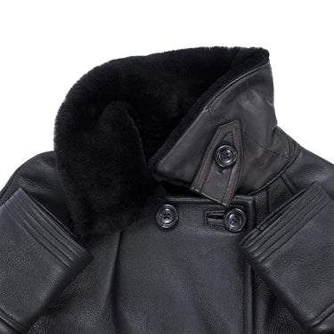 Angled close-up of the collar and button tab showing soft shearling interior and structured neckline