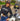 Woman wearing Legendary USA Booty Call cropped hoodie, front view with logo text, standing beside classic motorcycle
