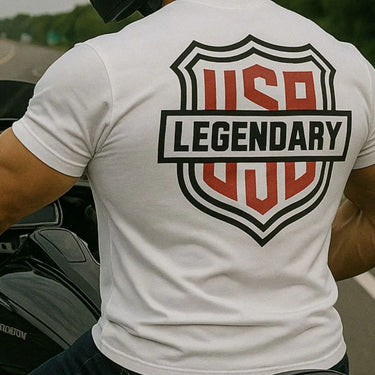 Lifestyle shot of rider wearing Legendary All American t-shirt with bold USA Legendary back graphic, riding motorcycle, made in USA