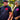 Man and woman wearing Legendary Color Shield Motorcycle T-Shirts outdoors, showcasing fit and red/pink logo, Made in USA