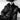 Black and white high-fashion portrait of a model in all-black outfit wearing Legendary USA deerskin gauntlet gloves