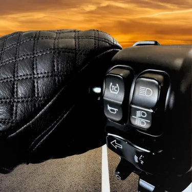 Legendary Double-Diamond Glove gripping motorcycle controls at sunset, showing quilted leather detail and fit, made in USA