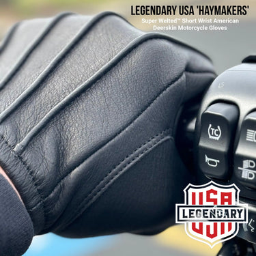 Close-up of Legendary Haymakers glove gripping motorcycle handlebar showing welted design, Made in USA