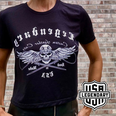 Lifestyle image of a woman wearing the black Legendary USA Chill Out Biker Chick Shirt with bold biker logo, Made in USA