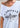 Close-up lifestyle image of a woman wearing the Legendary USA Chill Out Biker Chick Shirt off the shoulder, showing relaxed fit and edgy graphic, Made in USA