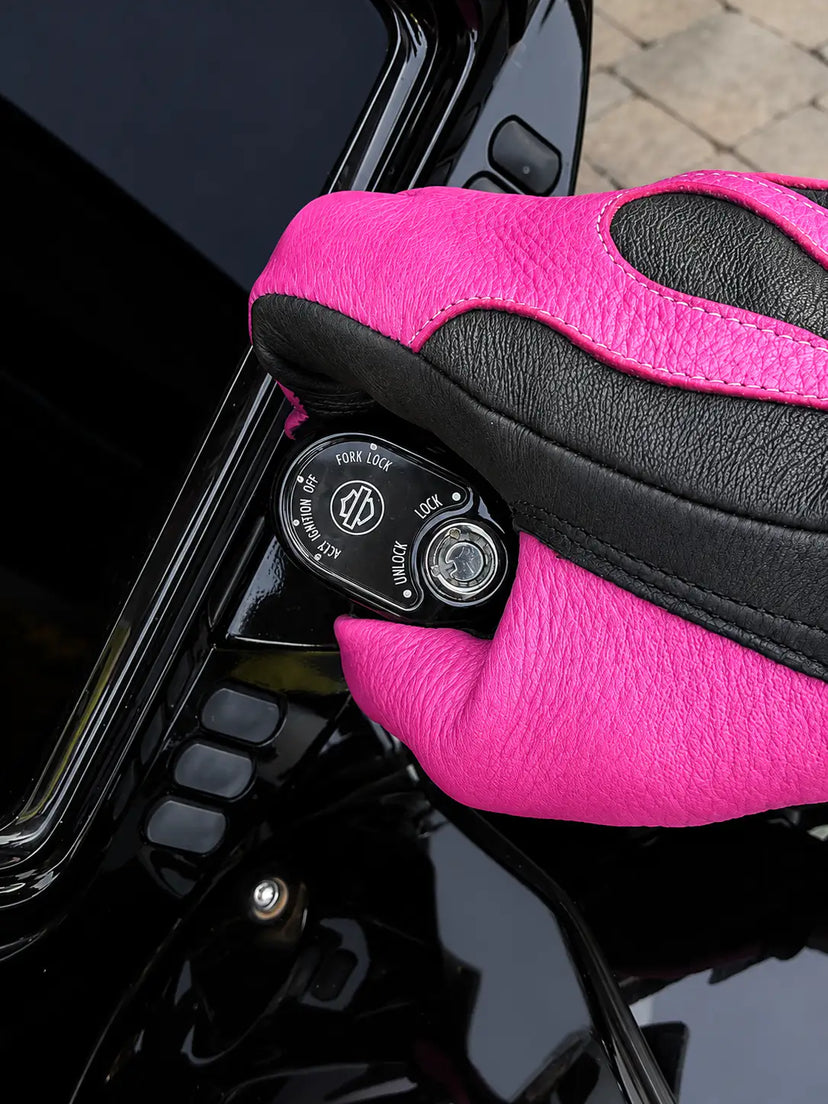 Spitfire Black/Neon Pink Gloves shown in a riding setting made in USA, a motorcycle glove