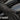 Rider wearing black deerskin gauntlet motorcycle gloves resting on Harley-Davidson tank, cold weather riding