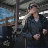 Side profile of Unik leather motorcycle jacket, with hardware and stitching visible