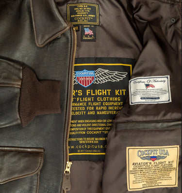 Inside view of Cockpit USA Men's 100 Mission A-2 leather jacket showing tag and lining