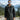 Cockpit USA Black Ops Shearling B-6 Bomber Jacket worn outdoors with mountain landscape in the background