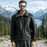 Cockpit USA Black Ops Shearling B-6 Bomber Jacket worn outdoors with mountain landscape in the background
