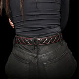 Model wearing diamond-stitched black leather belt with red stitching and jeans, Made in USA