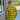 Construction detail of men's flannel yellow shirt, highlighting stitching and material grain