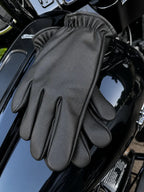 Classic Short Wrist Touchscreen Deerskin Gloves shown in a riding setting made in USA