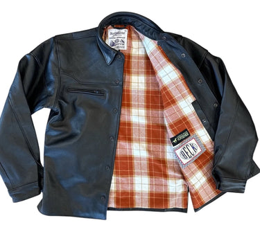 Interior view of BECK® 302 shirt with orange plaid flannel lining and visible horsehide and BECK® logo tags.