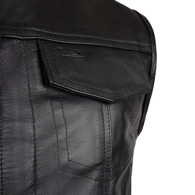 Close-up of front snap pocket on BECK® 566 black vest showing leather texture and stitching detail