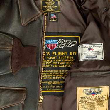 Inside view of Cockpit USA Men's 100 Mission A-2 leather jacket showing tag and lining