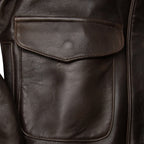 Close-up of front pocket detail on Cockpit USA Men's 100 Mission A-2 flight jacket