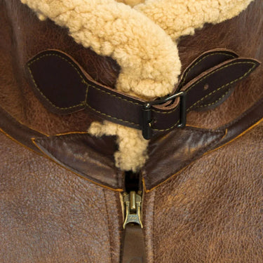 Close-up of shearling collar with leather throat latch strap on Cockpit USA Men's B-6 Jacket