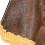 Close-up of sleeve and cuff construction with tan shearling on Cockpit USA B-6 Bomber Jacket