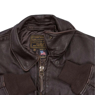 Close-up of collar and zipper area on Cockpit USA Men's Carrier Pilot Flight Jacket showing interior labels