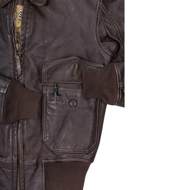 Detailed view of front pocket and pen slot on Cockpit USA Men's Carrier Pilot Leather Jacket