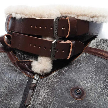 Close-up of double throat buckle straps on Cockpit USA 100 Mission B-3 Sheepskin Bomber Jacket