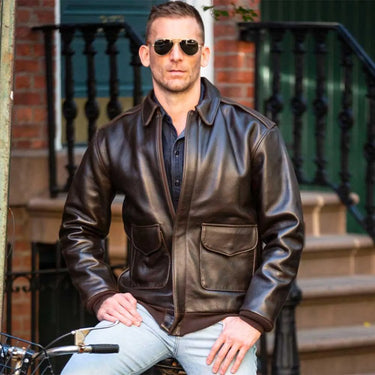 Model wearing Cockpit USA A-2 Flight Jacket with jeans and sunglasses in outdoor urban setting