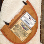 Close-up view of hood with coyote fur trim and double buckle throat latch on Hooded B-3 Jacket