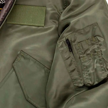 Close-up of sleeve pocket and stitching on Cockpit USA Men's green CWU-55/P Flight Jacket