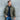 Model wearing Cockpit USA Men's M65 Field Jacket outdoors, premium product detail