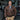 Man wearing the Mustang A-2 leather flight jacket standing in front of an aircraft