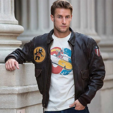 Male model wearing Cockpit USA Men's Black Eagle Flight Jacket styled with vintage aviation t-shirt