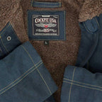 Close-up of Cockpit USA label stitched into the Men's N1 Bedford Cord Deck Jacket in navy