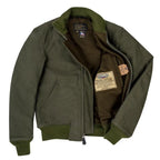 Inside view of olive WWII Tanker Jacket showing brown wool lining and authenticity label