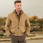 Model wearing Cockpit USA Men's British Khaki WWII Tanker Jacket in military setting