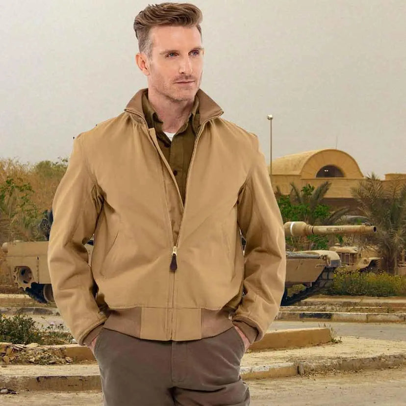 Model wearing Cockpit USA Men's British Khaki WWII Tanker Jacket in military setting