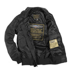 Interior view of the Cockpit USA USN Fighter Jacket showing large printed label and tag details.
