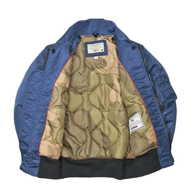 Interior view of the Cockpit USA Women's B-15 Jacket showing camouflage quilted lining.